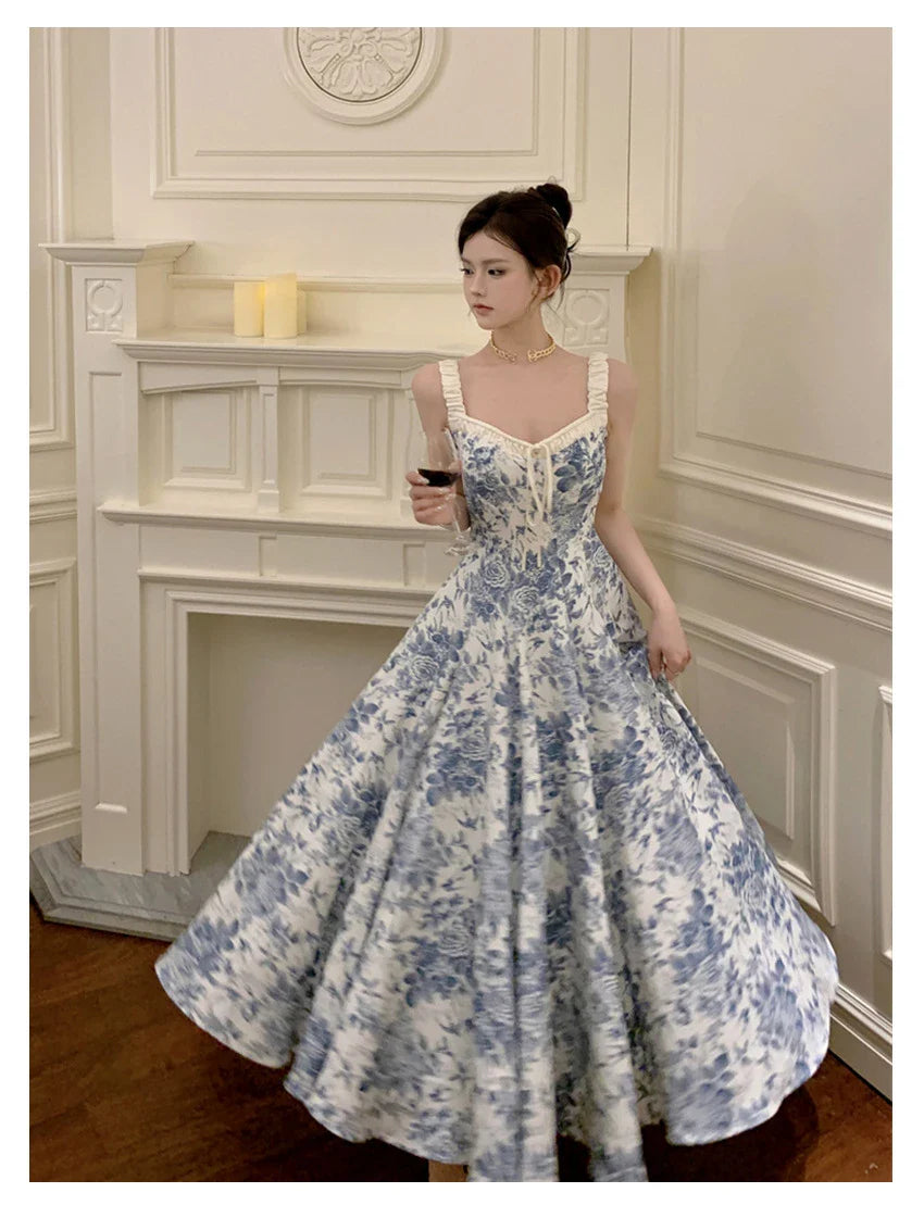 Elegant floral print dress with adjustable straps, A-line silhouette, and high-waisted design for a timeless British fashion look.