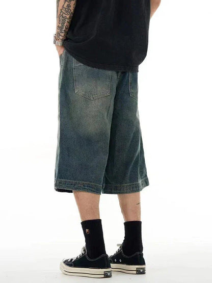 Relaxed-fit men's denim shorts in a vintage blue wash, featuring a wide-leg silhouette and adjustable waistband for maximum comfort.