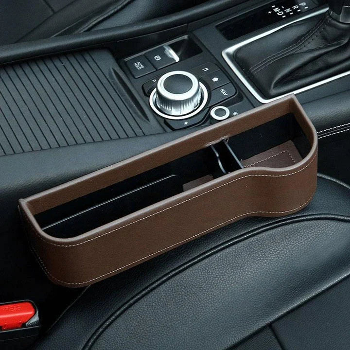 Premium multifunctional car seat organiser with various compartments for storing phones, chargers, pens, and other car essentials