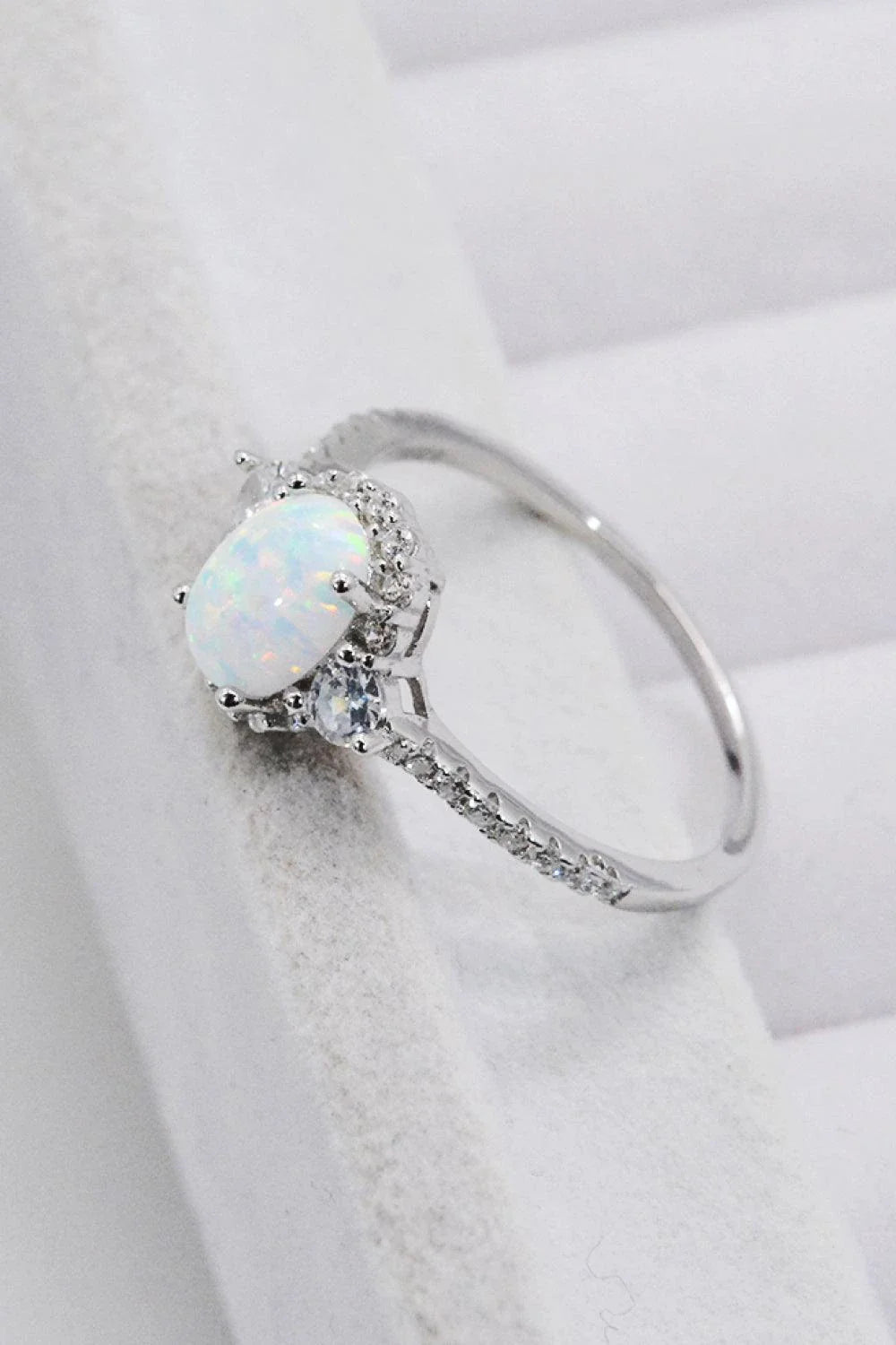 A stunning platinum-plated opal ring made from 925 sterling silver, featuring a modern and minimalist design