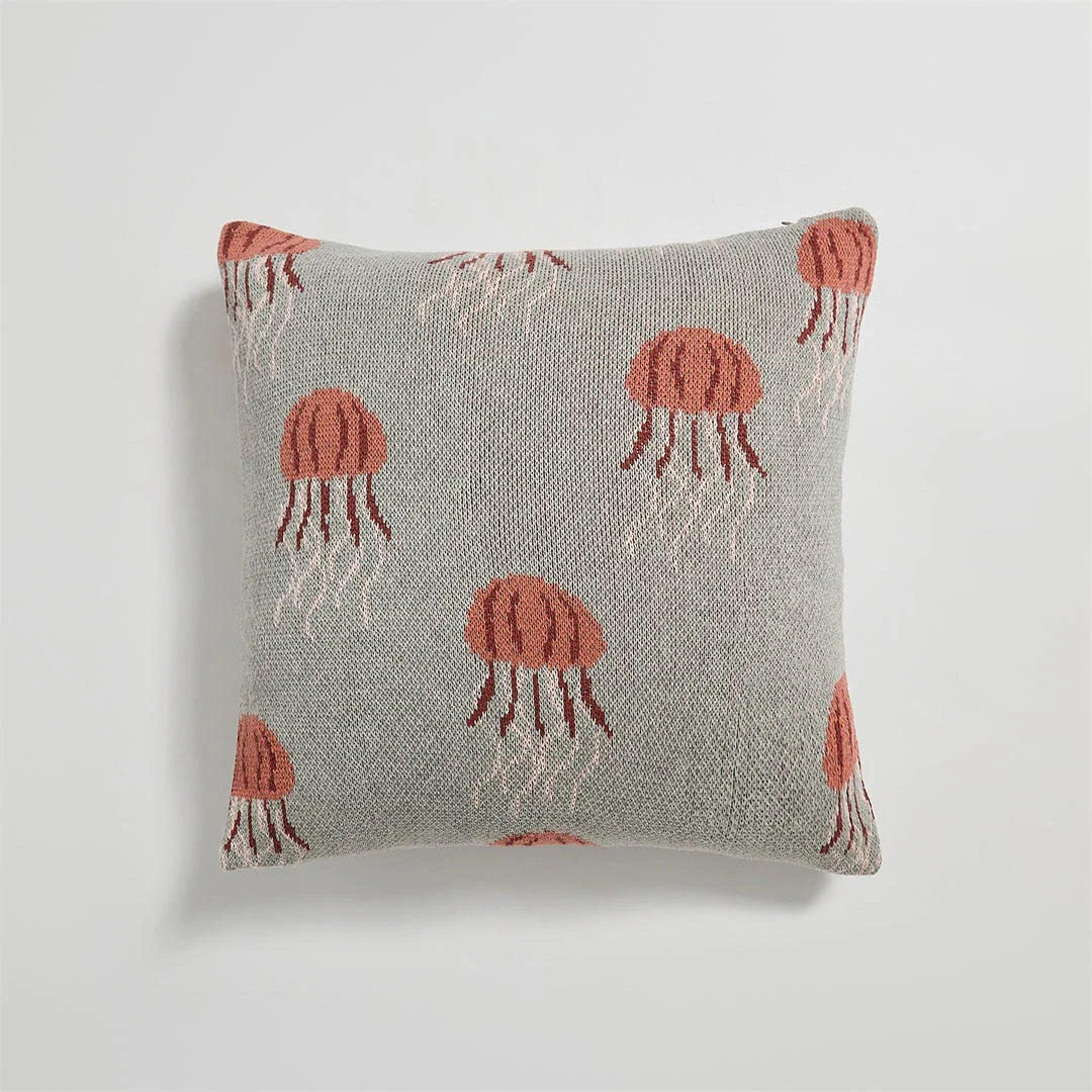 Elegant knitted cotton cushion cover featuring a detailed embroidered jellyfish design, available in grey and green colours.