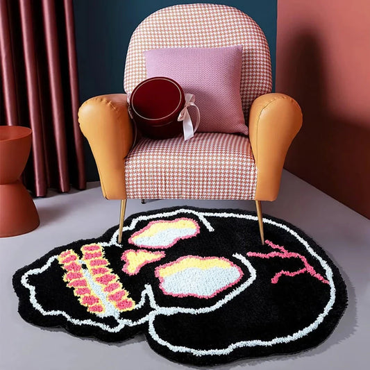 A stylish, black and pink skull-patterned area rug with an irregular, funky design for a modern living room or bedroom
