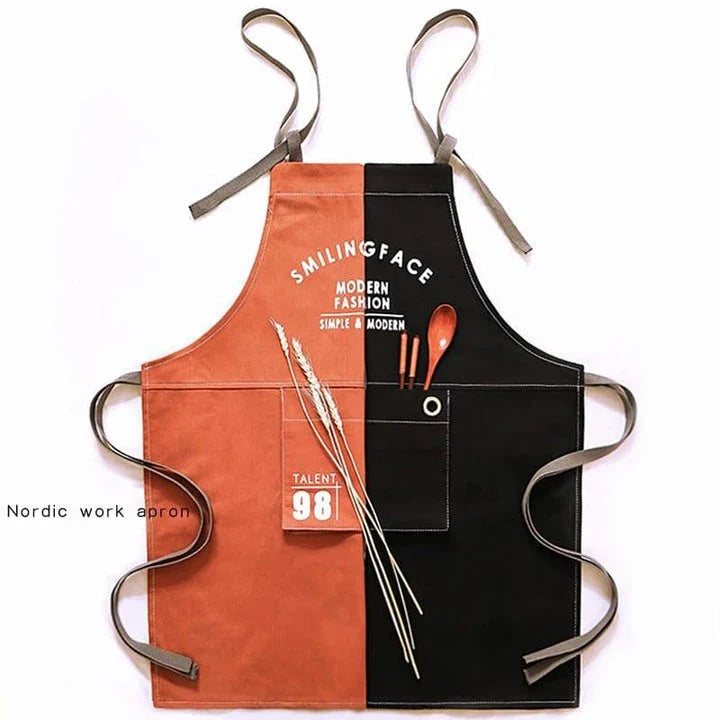 A stylish and practical Nordic-inspired canvas barista apron with a spacious front pocket and adjustable neck strap for a comfortable fit.