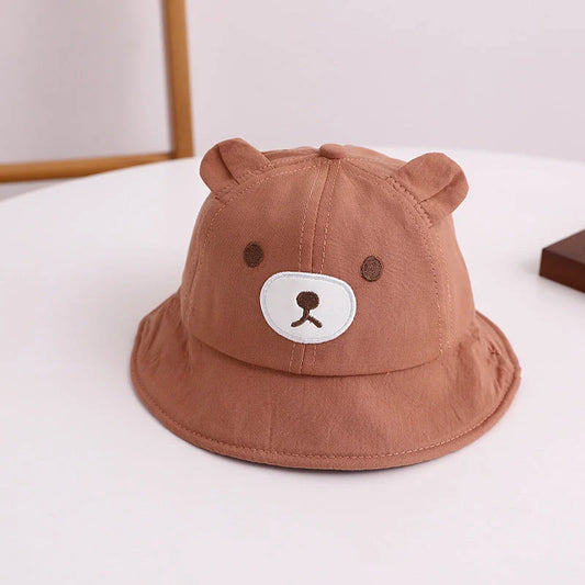 Adorable kids' bear-themed panama bucket hat with soft, breathable fabric and adjustable fit for sun protection and style