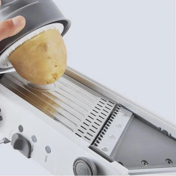 Premium manual vegetable slicer with stainless steel blades and ABS frame for effortless slicing, dicing, and shredding of fresh produce