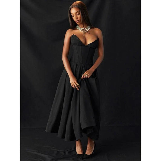 Elegant, backless A-line midi dress in black for women, featuring a sleek silhouette and sophisticated draping