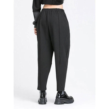 Stylish high elastic waist black harem trousers with a split joint design, offering a comfortable and fashionable look