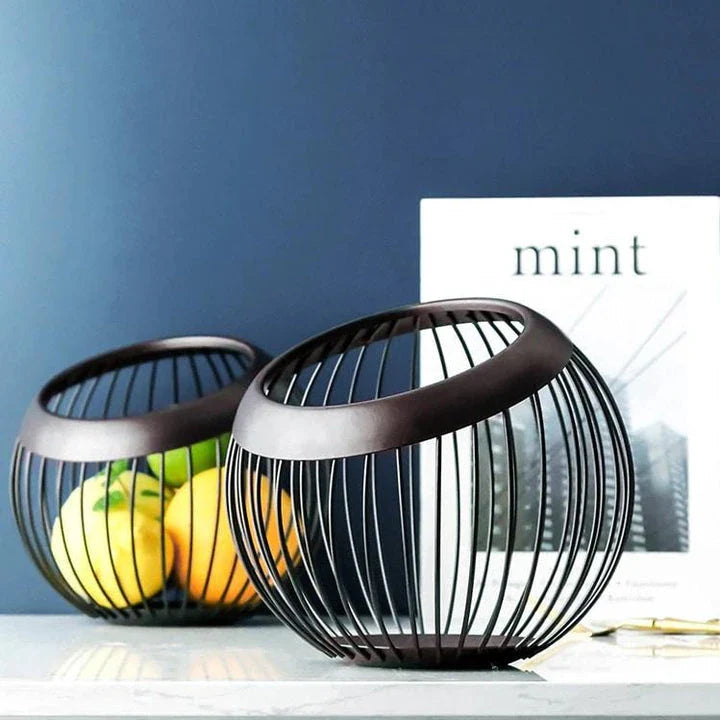 Black Nordic-style metal drain basket with perforated design for efficient drainage