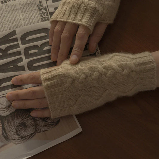 Luxurious cashmere gloves in beige and camel colours, showcasing a unique twist design for a stylish, streamlined silhouette