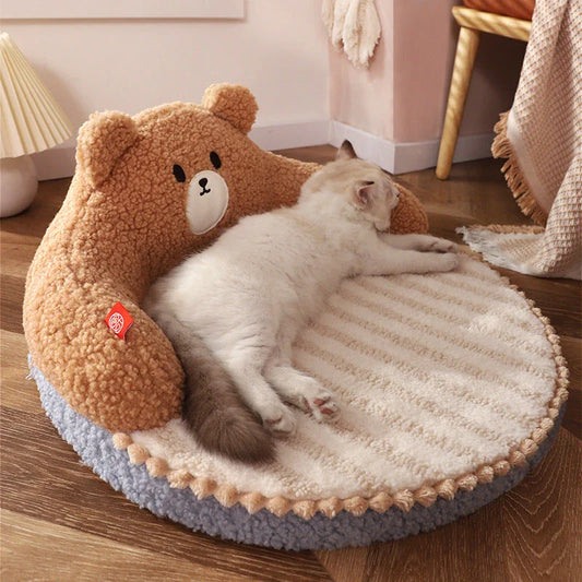 Cosy bear-shaped pet bed in pink colour, designed for cats and small dogs up to 16.5 lbs, with a plush, supportive interior and removable, washable mat.