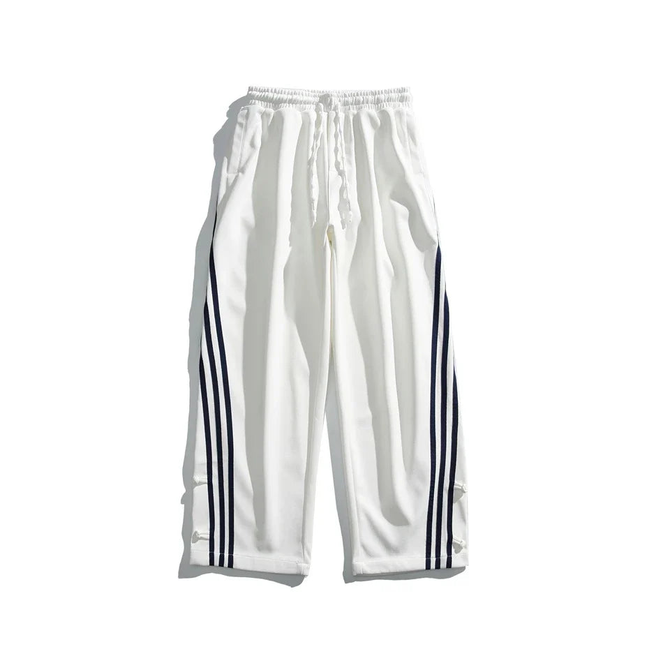 Stylish striped sports trousers in a relaxed, mid-waist design for versatile leisure and athletic wear
