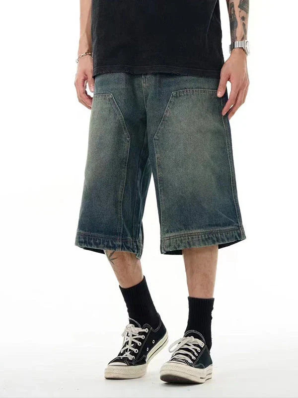 Relaxed-fit men's denim shorts in a vintage blue wash, featuring a wide-leg silhouette and adjustable waistband for maximum comfort.