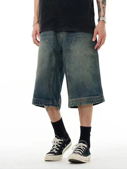 Relaxed-fit men's denim shorts in a vintage blue wash, featuring a wide-leg silhouette and adjustable waistband for maximum comfort.