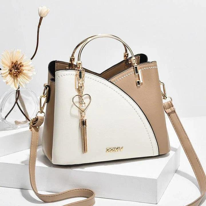 Sophisticated navy blue PU leather bucket crossbody bag with elegant patchwork design and adjustable strap