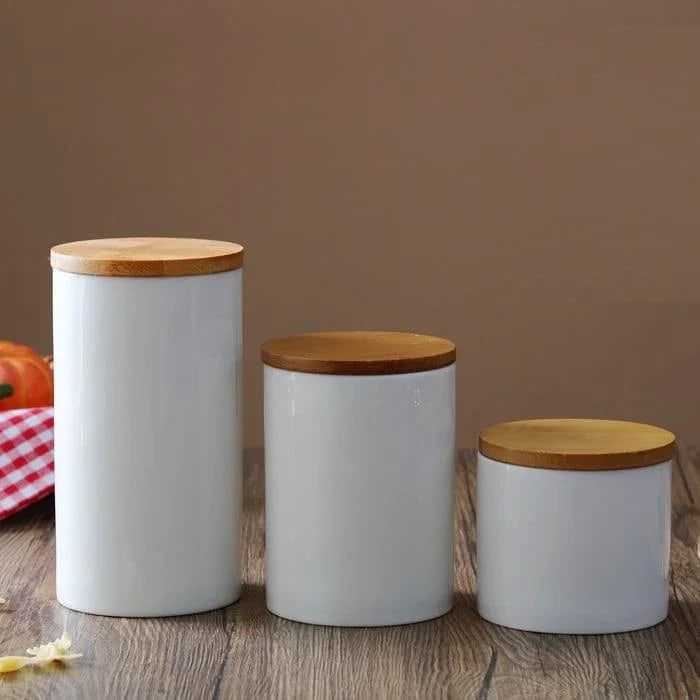A ceramic kitchen jar with a bamboo lid, available in three sizes to suit your storage needs