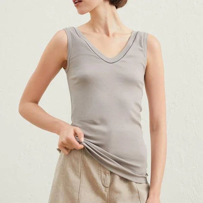 100% wool sleeveless knit vest with delicate beading, available in white colour and multiple sizes