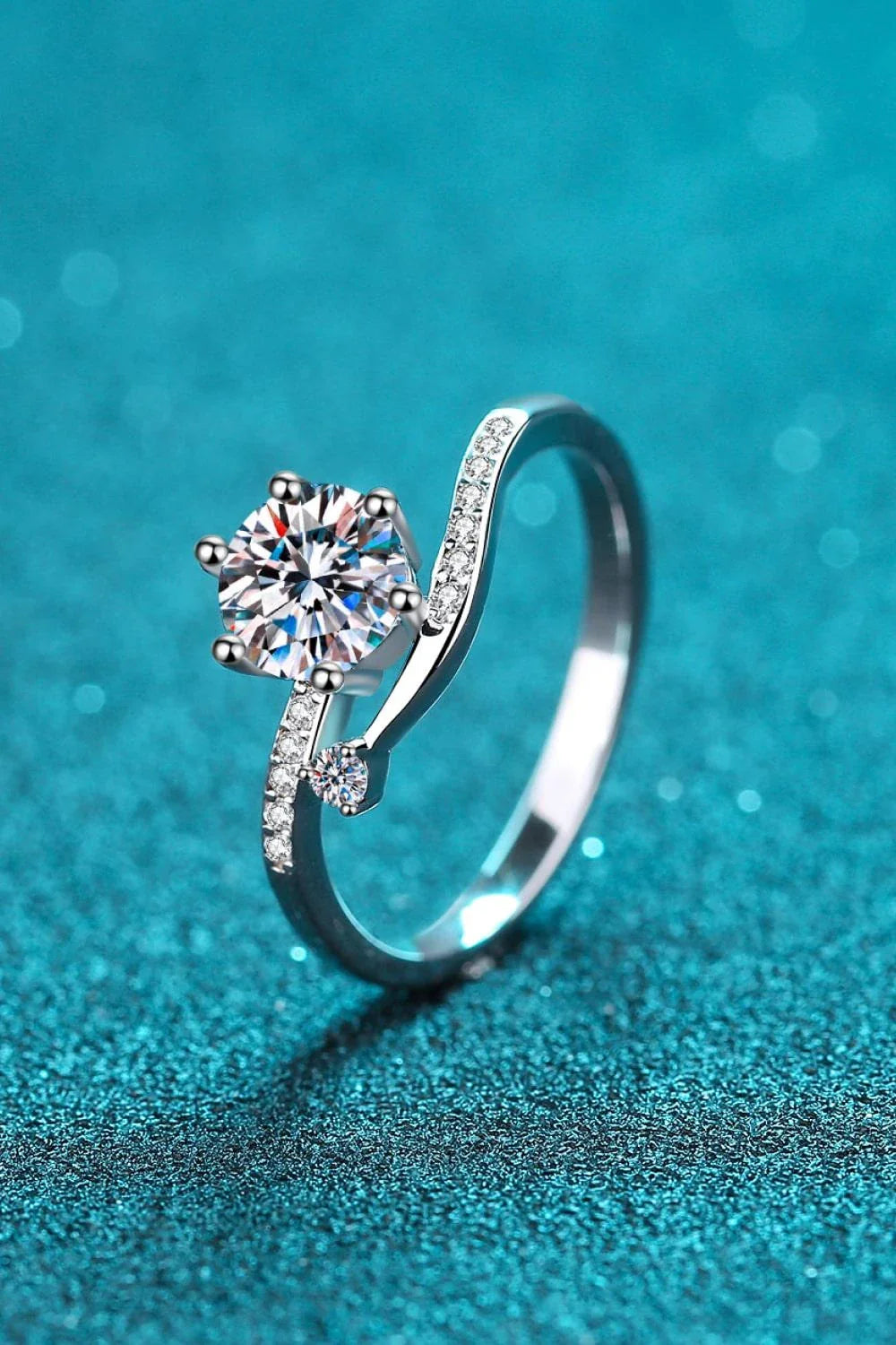 Elegant Moissanite and Sterling Silver Ring with a sparkling centre stone, delicate zircon accents, and a luxurious 925 sterling silver setting
