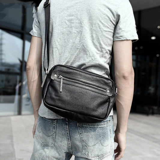 A premium British leather shoulder bag with a sleek, minimalist design and adjustable strap