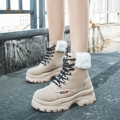 Stylish British platform boots with faux suede upper, lace-up closure, and wedge heel design