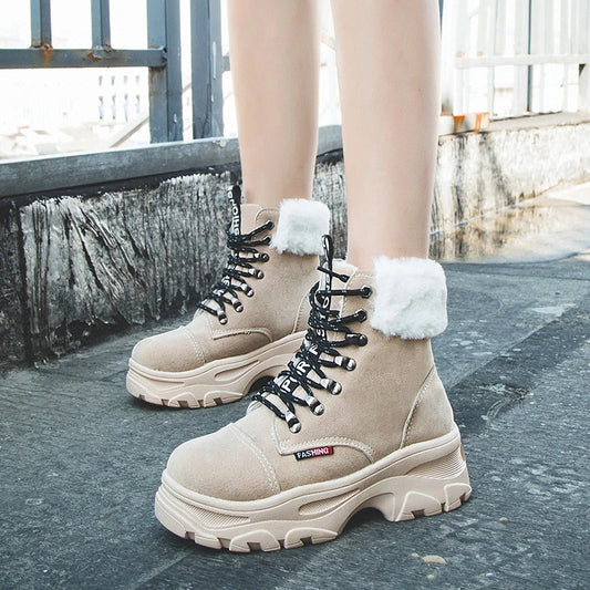 Stylish British platform boots with faux suede upper, lace-up closure, and wedge heel design