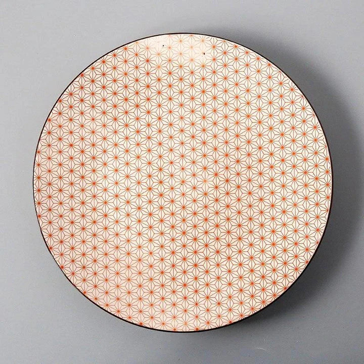 Elegant ceramic plates with vibrant, whimsical prints in a variety of enchanting designs