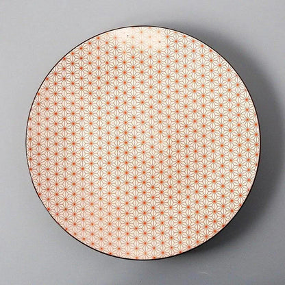Elegant ceramic plates with vibrant, whimsical prints in a variety of enchanting designs