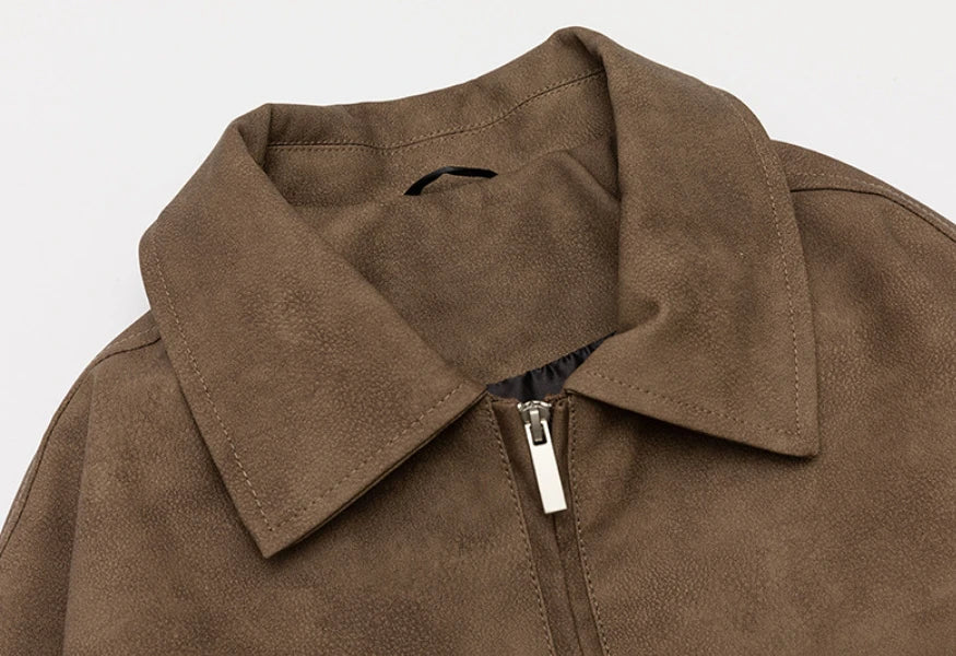 A classic distressed leather jacket in a relaxed, unstructured fit suitable for both men and women