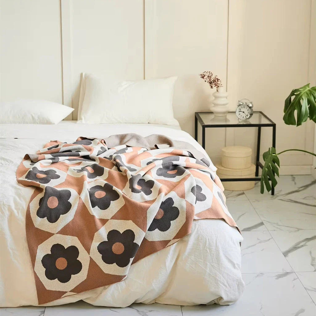 Floral knitted cotton throw blanket in a cosy Matcha Green colour, perfect for British homes and outdoor adventures.