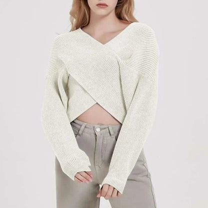 A cosy, brown V-neck knitted jumper with a relaxed, comfortable fit and a touch of vintage-inspired style.