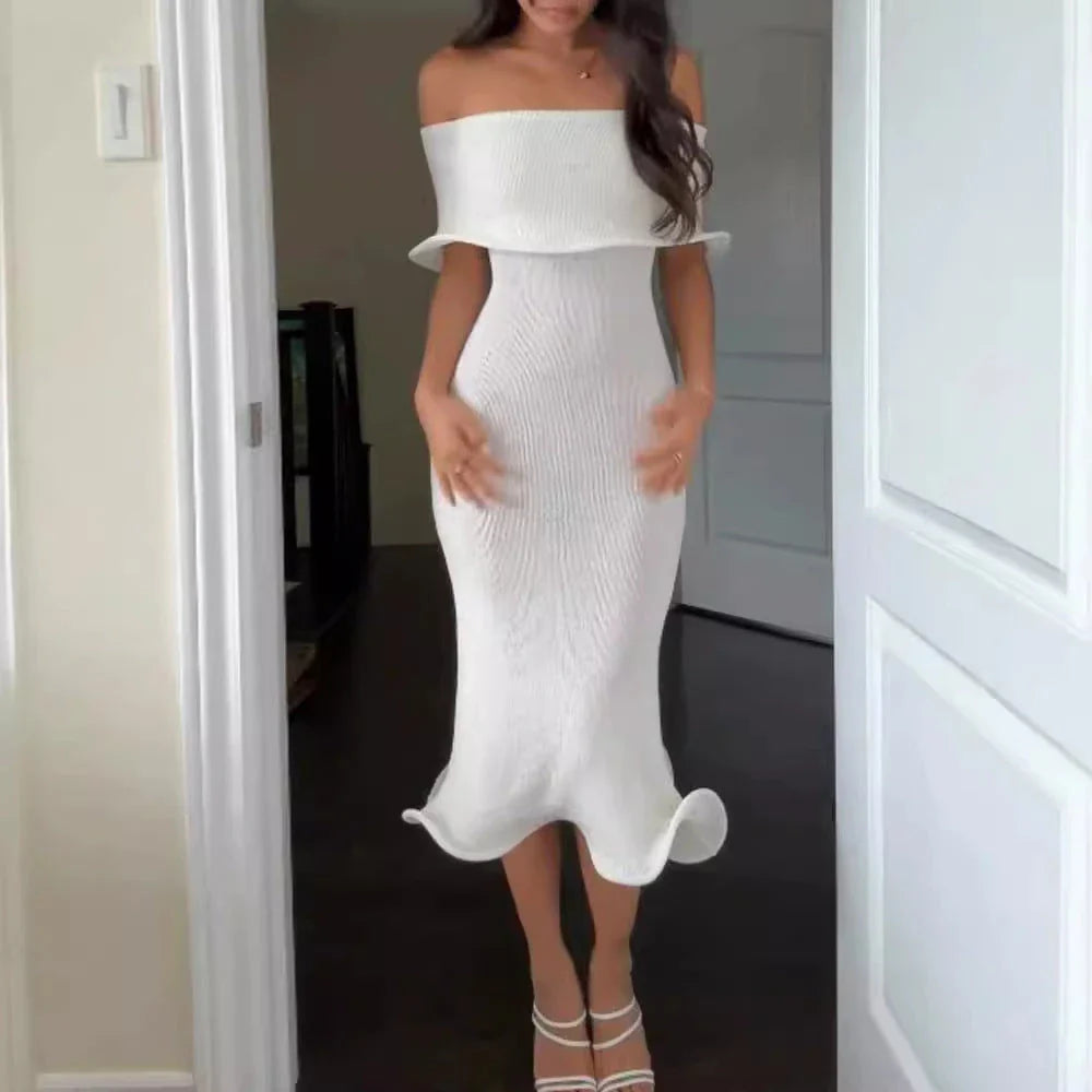 Chic white sleeveless dress with slim-fit silhouette, perfect for stylish occasions in the UK