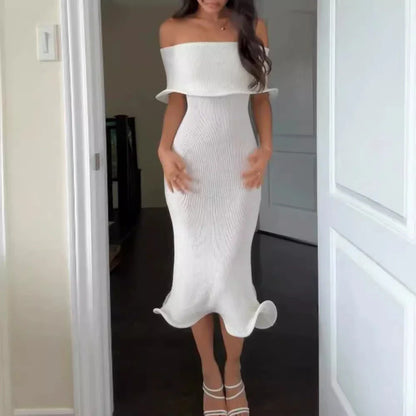 Chic white sleeveless dress with slim-fit silhouette, perfect for stylish occasions in the UK