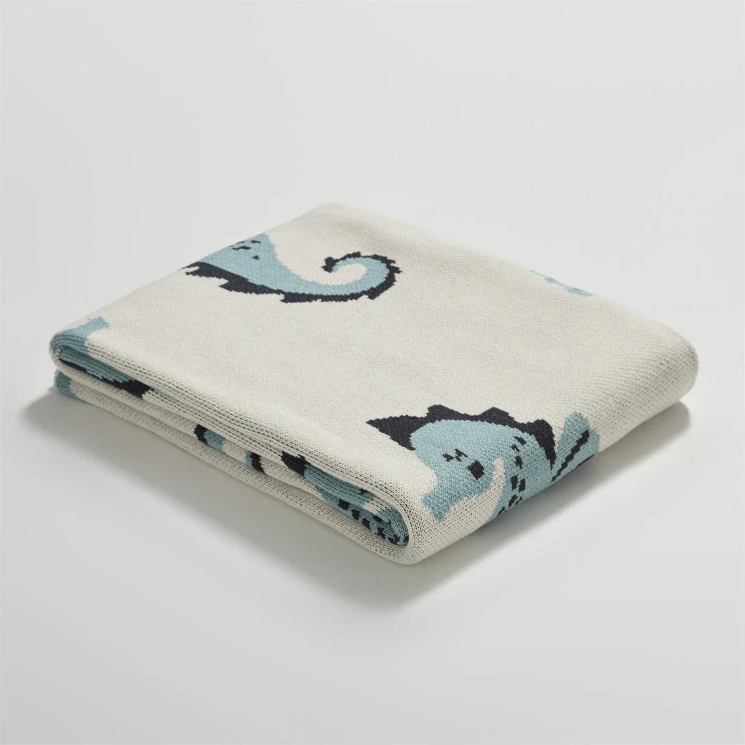 Soft and cosy 100% cotton blanket with a charming sea horse design, perfect for relaxation at home or on the go.