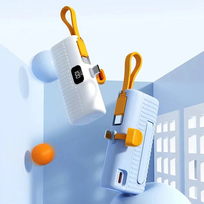 Compact, high-capacity power bank with dual charging ports and built-in cables for convenient, fast charging on the go