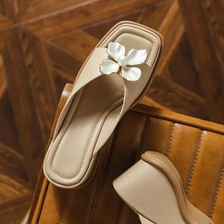 Elegant pearl flower wedge sandals in beige colour, featuring a thick, cushioned platform and adjustable straps for a comfortable fit.