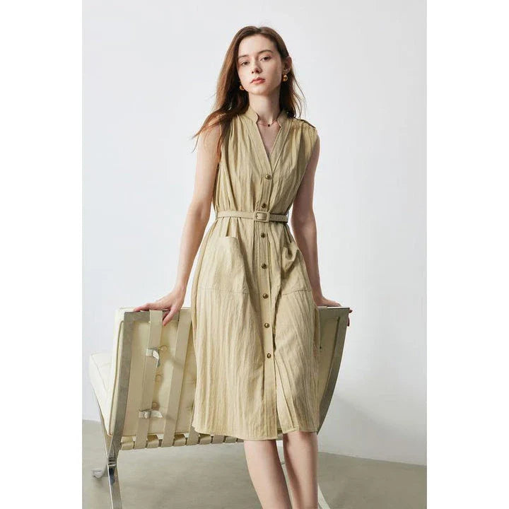 Elegant sleeveless midi shirt dress with V-neck and side pockets, perfect for summer in the UK