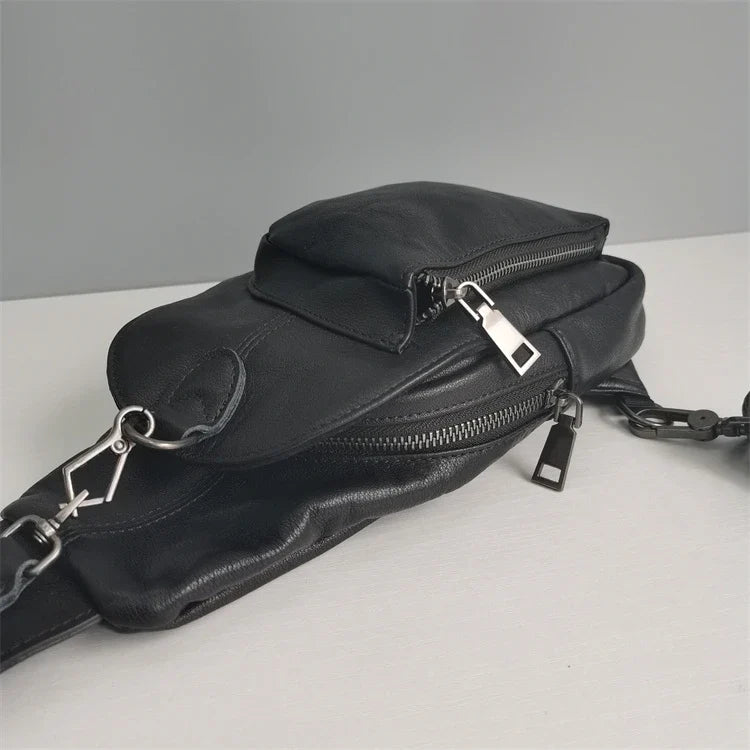 Premium black leather chest bag with zipper closure, adjustable strap, and ample storage space for everyday essentials
