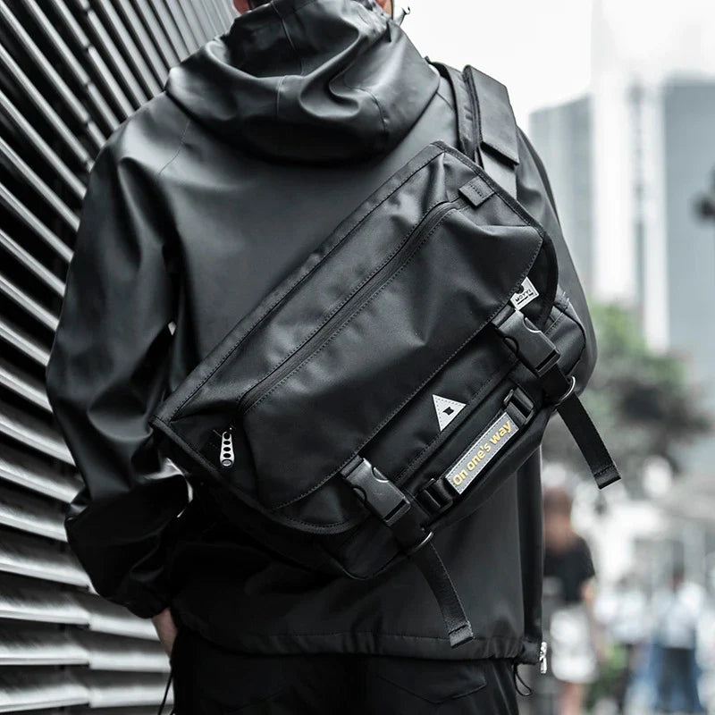 Premium casual messenger bag made with Oxford spinning material, featuring a structured yet soft exterior, ample storage space, and a water-resistant design for the modern British gentleman.
