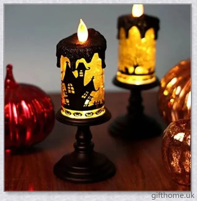 Candlite 10-inch Grand Glittering Halloween LED Candles with intricate designs of spiders, skulls, and other spooky elements