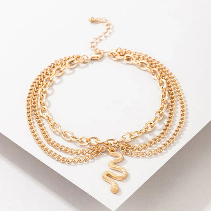 A stylish gold boho anklet with delightful tassels, starfish, and heart charms, perfect for summer outings and everyday wear.