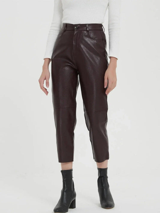 Pair of high-waisted, ankle-length faux leather trousers in a classic brown colour