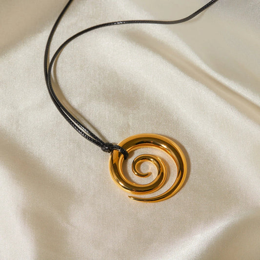 Exquisite spiral circle pendant necklace with 18K gold plating and black rope chain, a versatile accessory for the modern British woman.