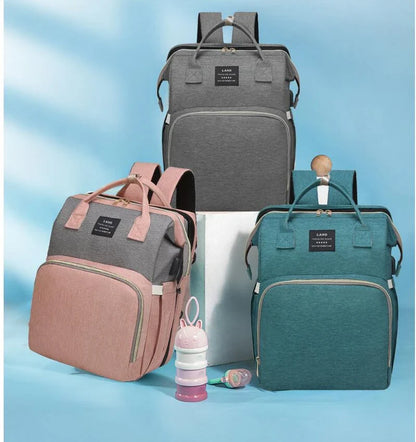 Multifunctional maternity diaper backpack with removable mosquito net, foldable crib, and water-resistant design for convenient family travel