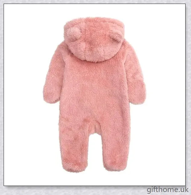 Adorable baby wearing a cosy hooded jumpsuit in blue, pink, or apricot colour