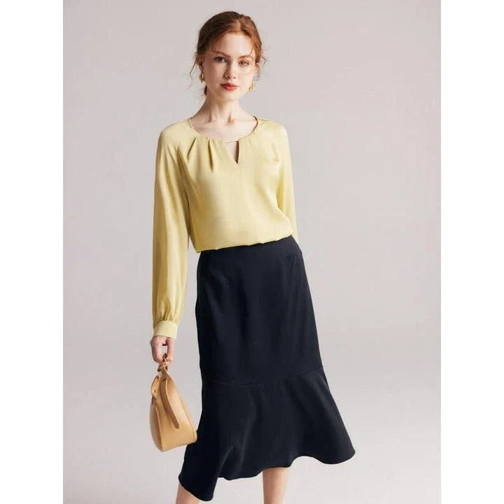 Elegant silk-blend blouse with raglan sleeves, featuring a timeless design and unique hollow-out details