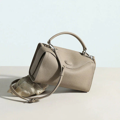 Premium British cowhide leather shoulder bag with multiple interior pockets and adjustable strap for versatile wear