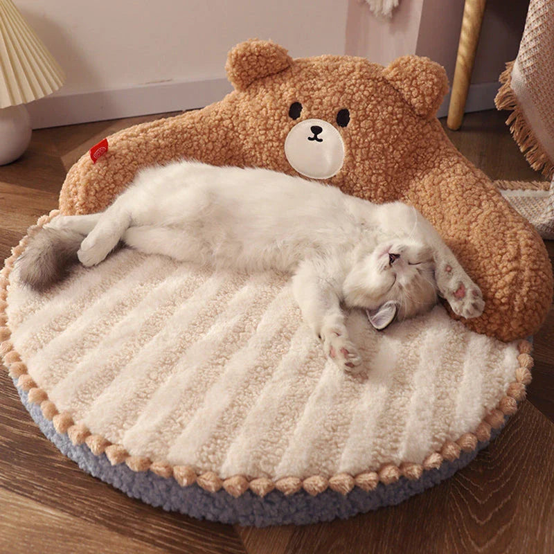 Cosy bear-shaped pet bed in pink colour, designed for cats and small dogs up to 16.5 lbs, with a plush, supportive interior and removable, washable mat.