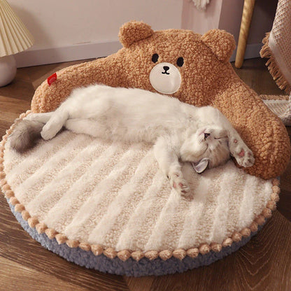 Cosy bear-shaped pet bed in pink colour, designed for cats and small dogs up to 16.5 lbs, with a plush, supportive interior and removable, washable mat.