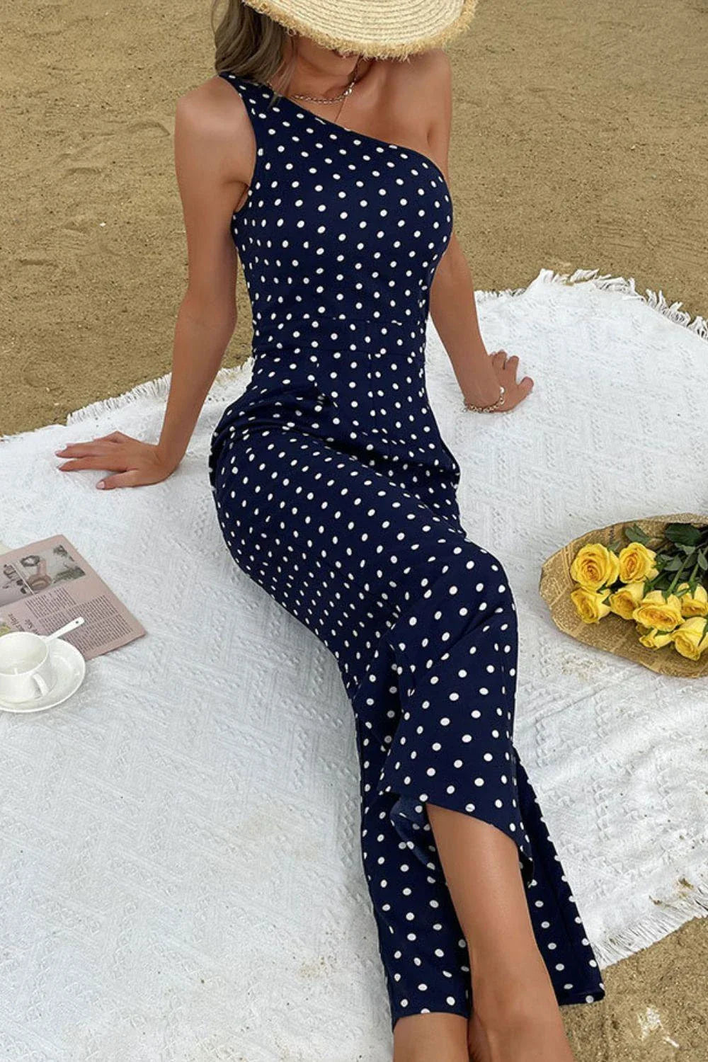 A stylish one-shoulder polka dot jumpsuit with a flattering, figure-hugging silhouette