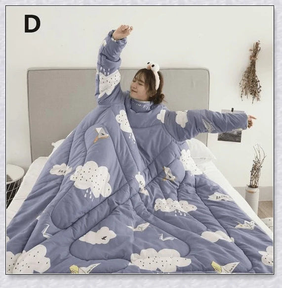 A cosy, wearable quilt with sleeves in a variety of colourful designs, perfect for staying warm and comfortable during the winter months.