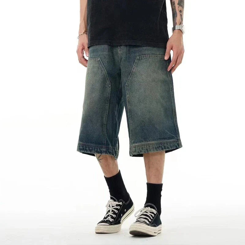 Relaxed-fit men's denim shorts in a vintage blue wash, featuring a wide-leg silhouette and adjustable waistband for maximum comfort.